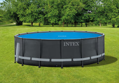 Intex cover floating on 16ft pool demonstrating debris protection benefit