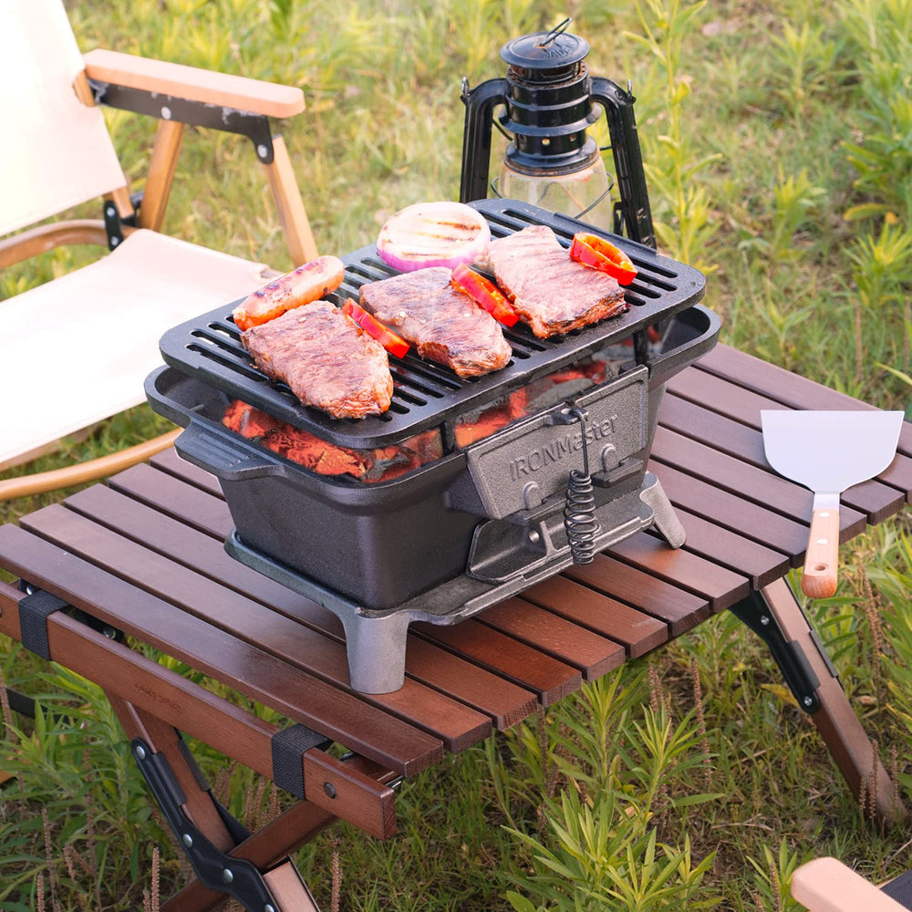IronMaster hibachi in a camping setup illustrating rugged outdoor use and reliable heat retention