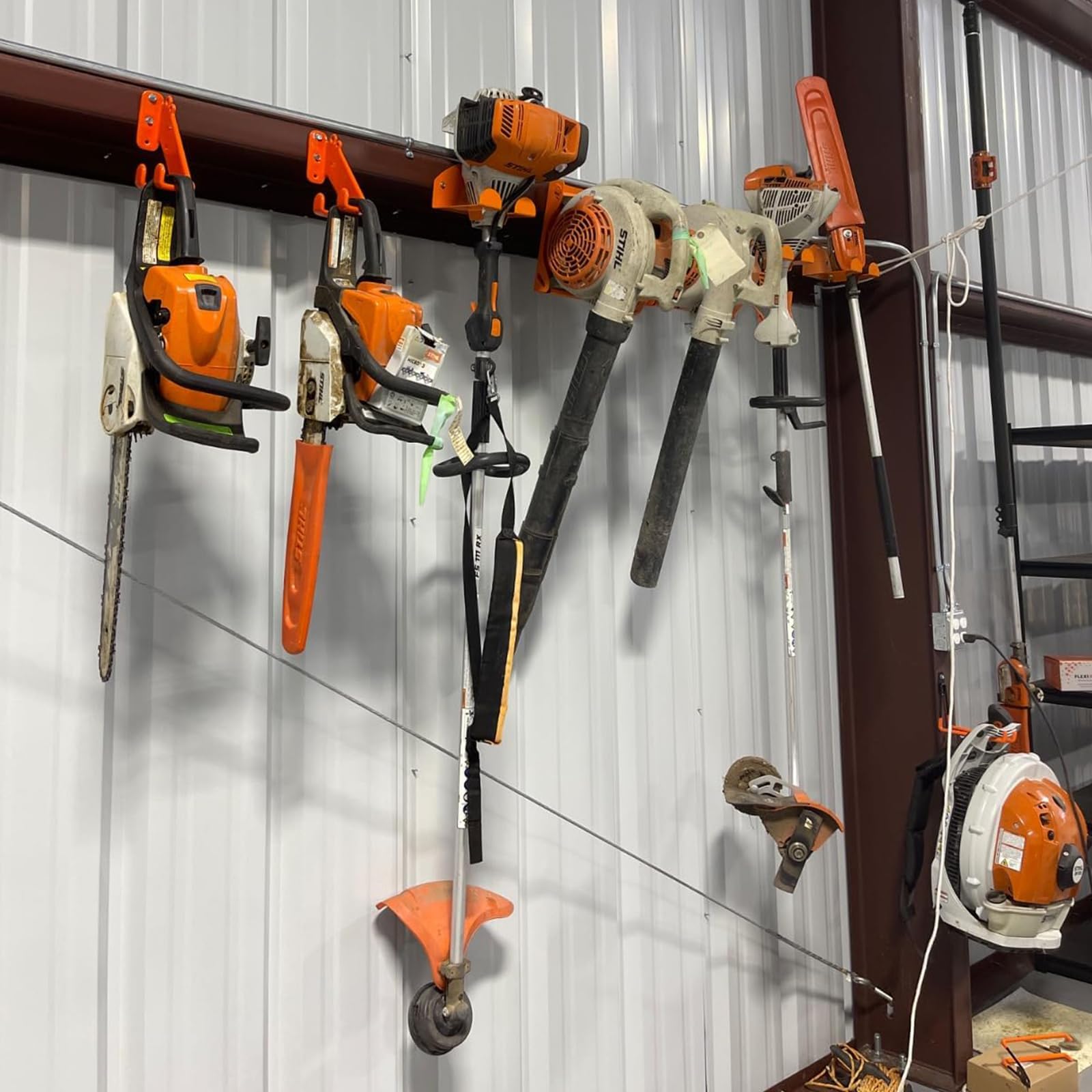 iulrtba next to ruler showing dimensions and fit for most chainsaws