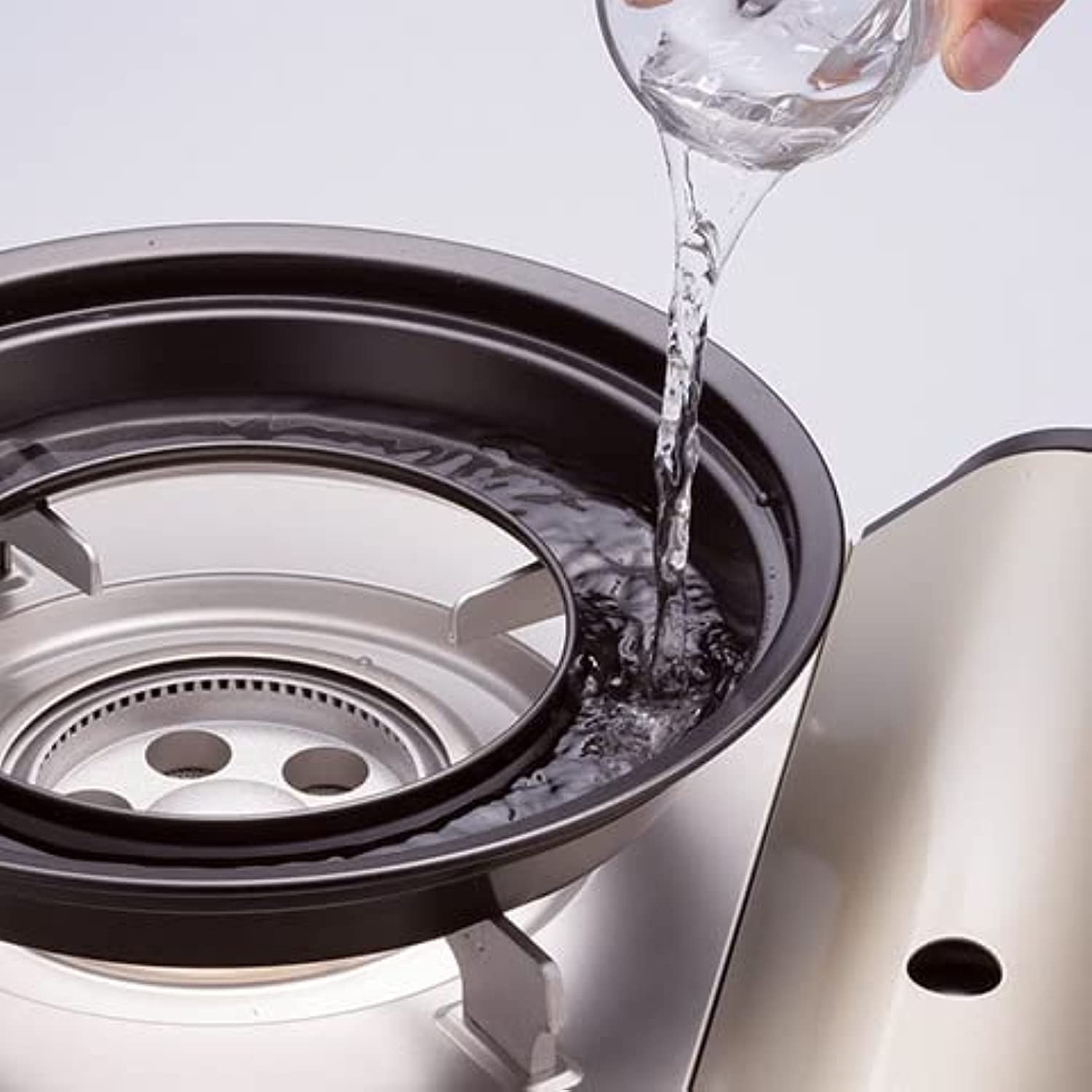 Iwatani grill plate packed for storage highlighting lightweight portability benefit