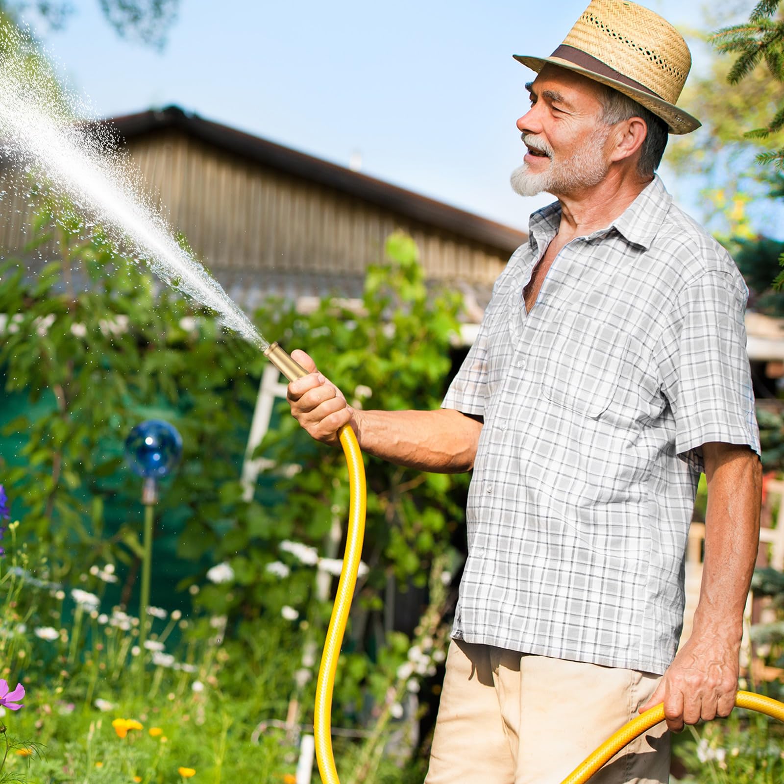 JaGely nozzle attached to garden hose in yard for versatile watering