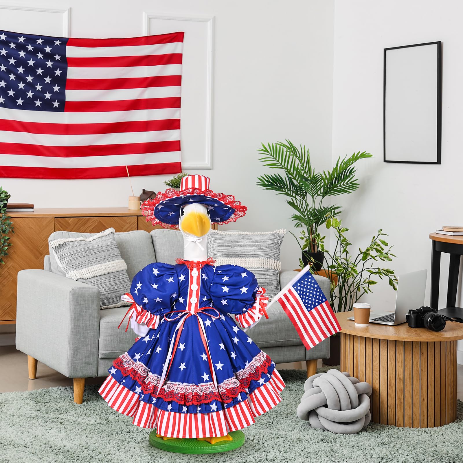 JcHrmers styled garden scene with dressed goose enhancing outdoor decor