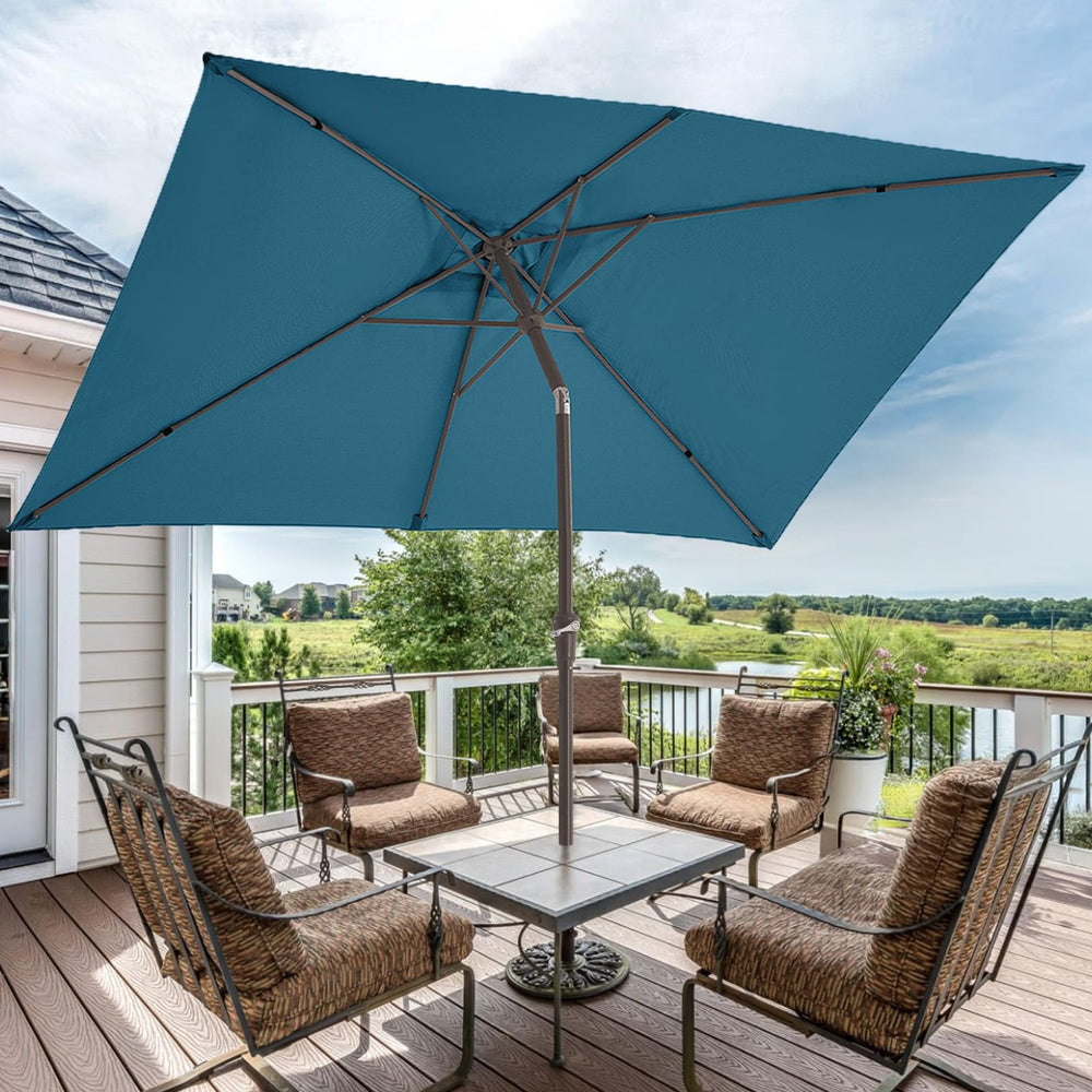 JEAREY umbrella in use over patio dining set offering shade