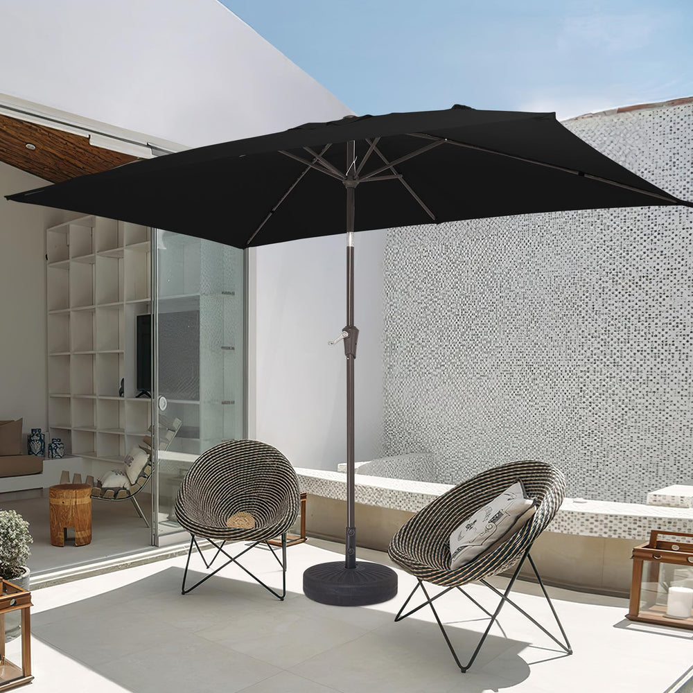 JEAREY umbrella beside table to show scale and seating coverage