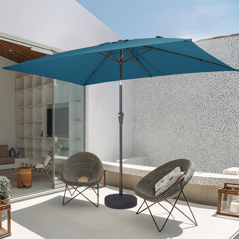 JEAREY umbrella beside chaise lounge demonstrating size coverage