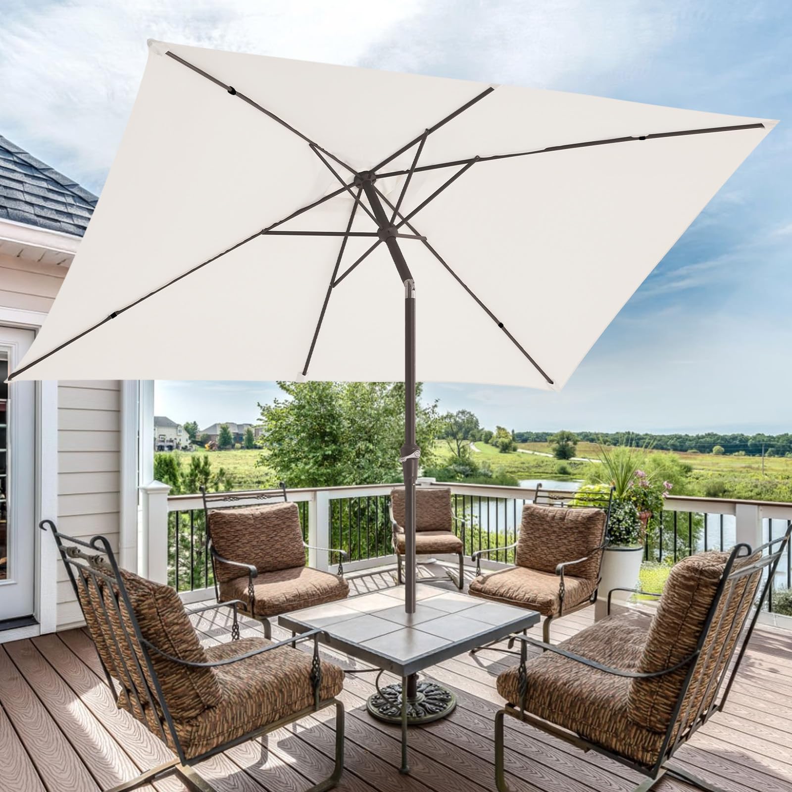 JEAREY umbrella over patio dining set providing comfortable shaded seating