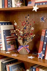 JEGERMIG tabletop tree on a mantel adding compact patriotic ambiance and easy placement