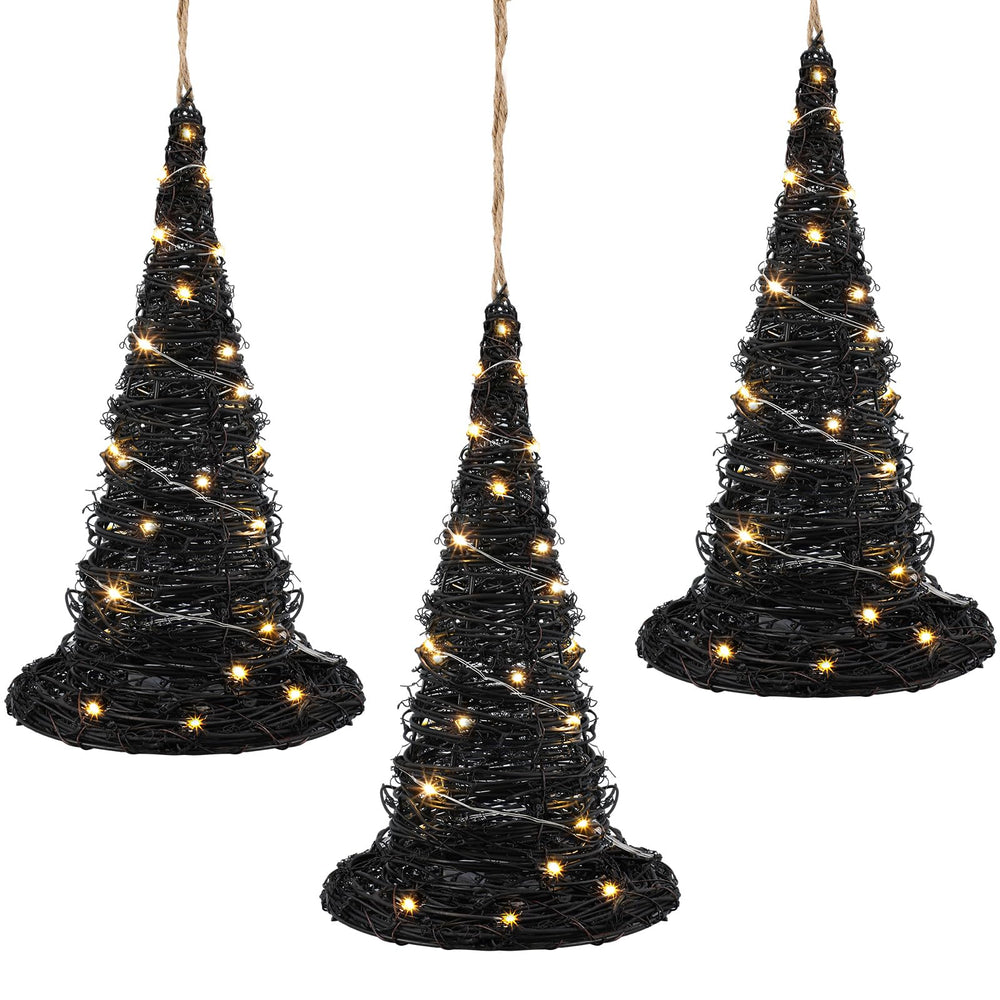 Jenaai three witch hats hanging from tree forming coordinated outdoor display