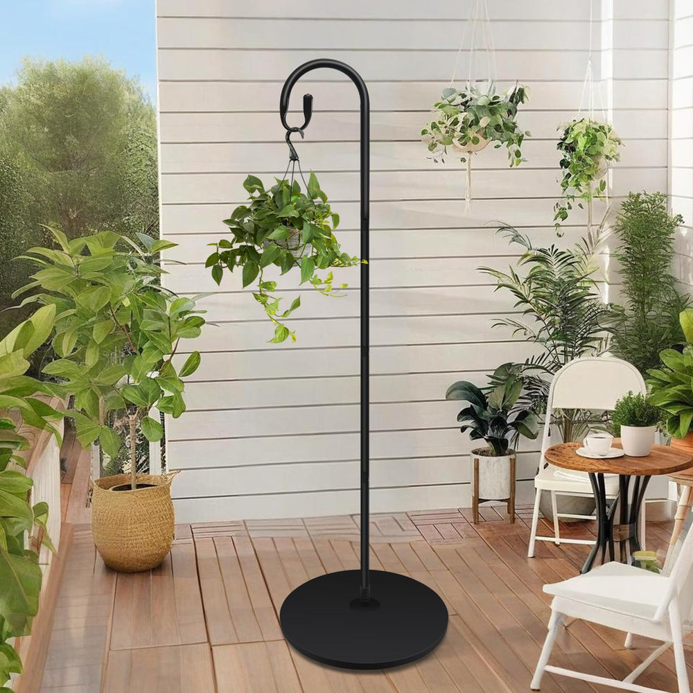 JETTIFY shepherds hook next to chair for scale showing full 63-inch height