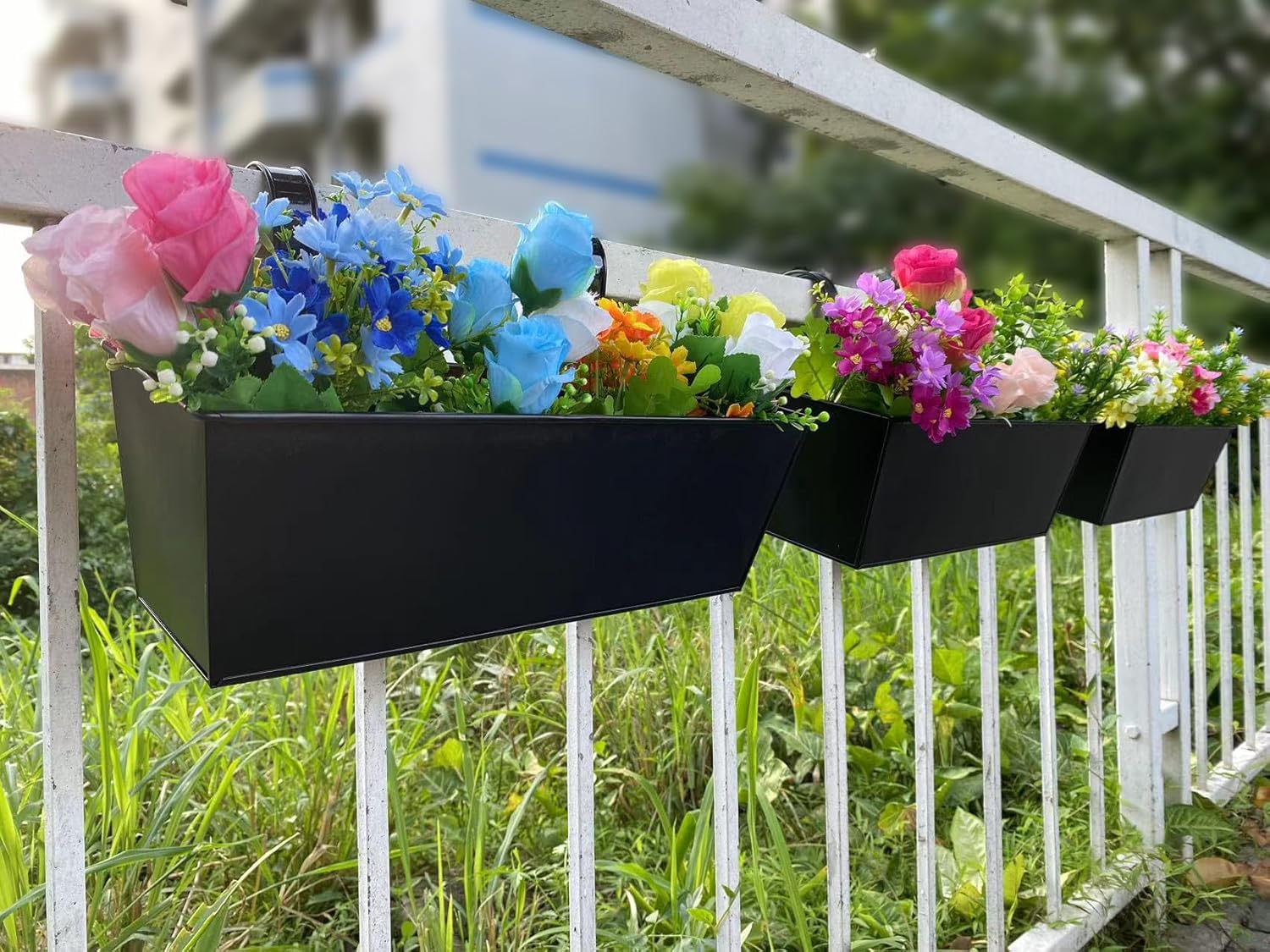 JFMAMJ planted herbs in railing boxes offering convenient fresh herbs