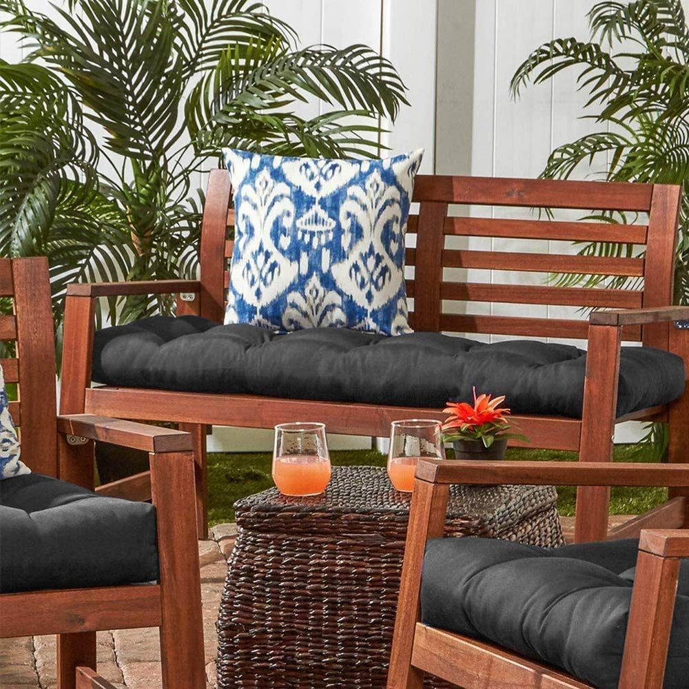 JimysCo cushion in use on a patio loveseat showing comfort and weather-ready styling
