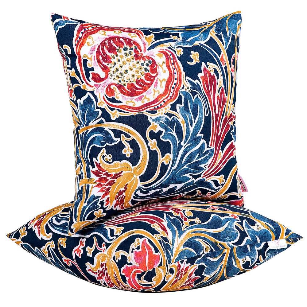 JMGBird front view shows bold blue pomegranate pillows, adds instant patio color