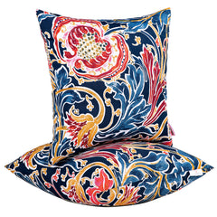 JMGBird front view shows bold blue pomegranate pillows, adds instant patio color