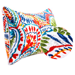 JMGBird paisley pillows styled on a patio sofa for refined outdoor decor