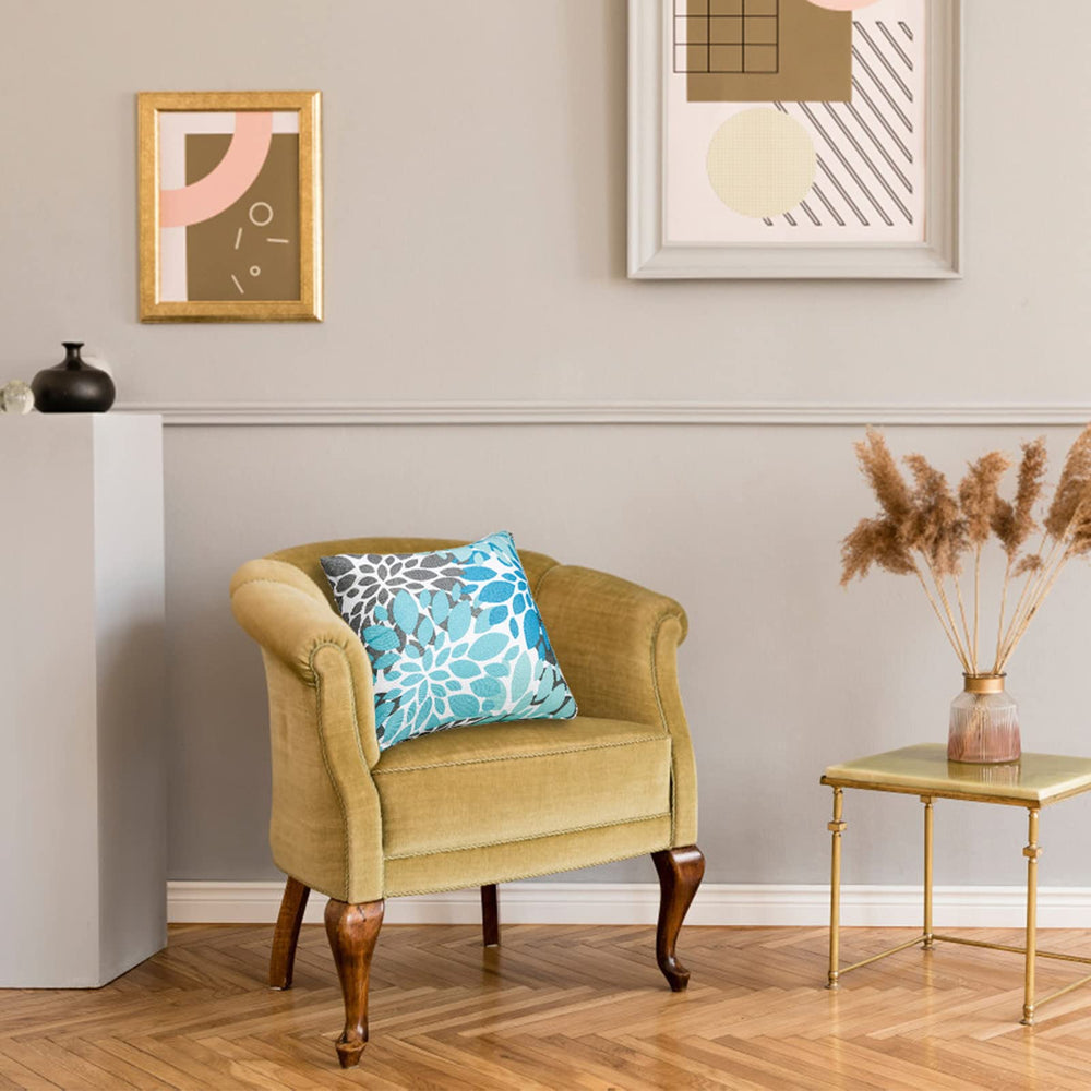 JMGBird pillows beside chair showing 18x18 inch size and scale