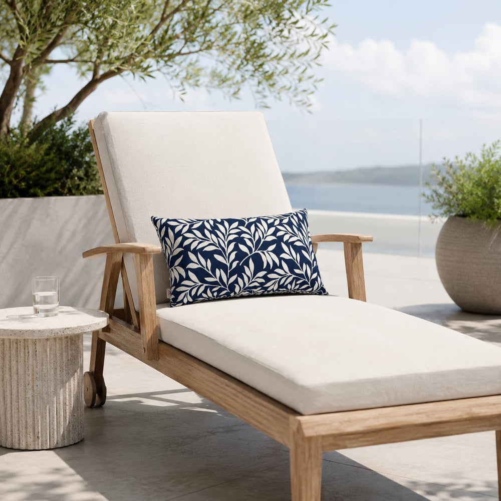 JMKaixin lumbar pillow on patio lounge adding comfort and vibrant color outdoors