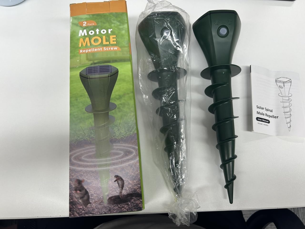 JNKNT device in garden demonstrating humane pest deterrent