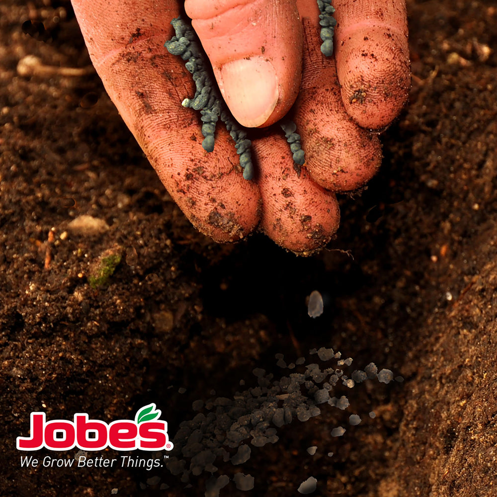 16 lb Jobe's Organics bag beside a yard tool to show scale and amount for season-long feeding