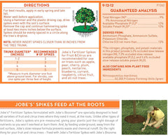 Jobe's Organics spikes inserted in soil demonstrating targeted root-zone feeding