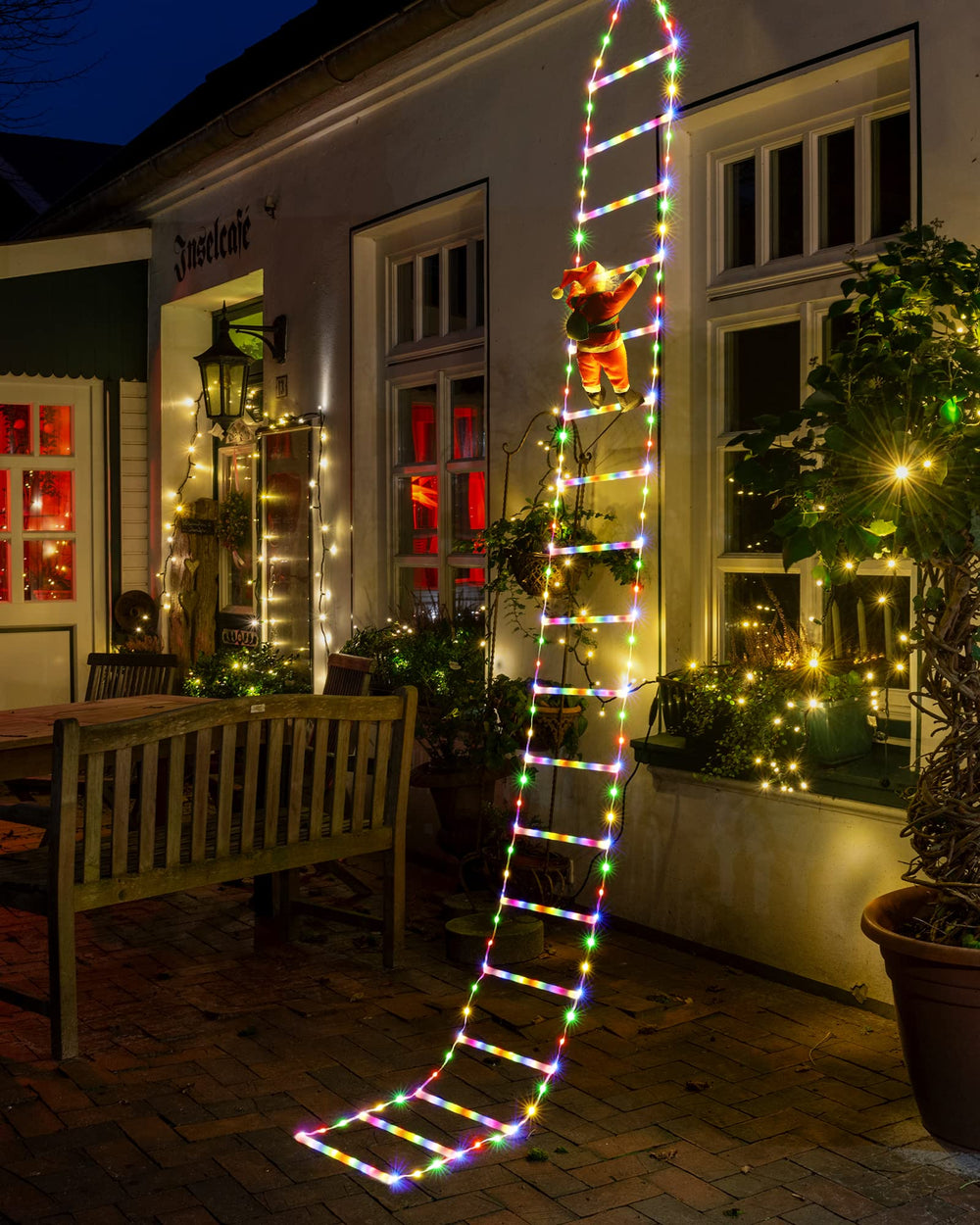 Joedoes ladder lights in window adding indoor festive lighting