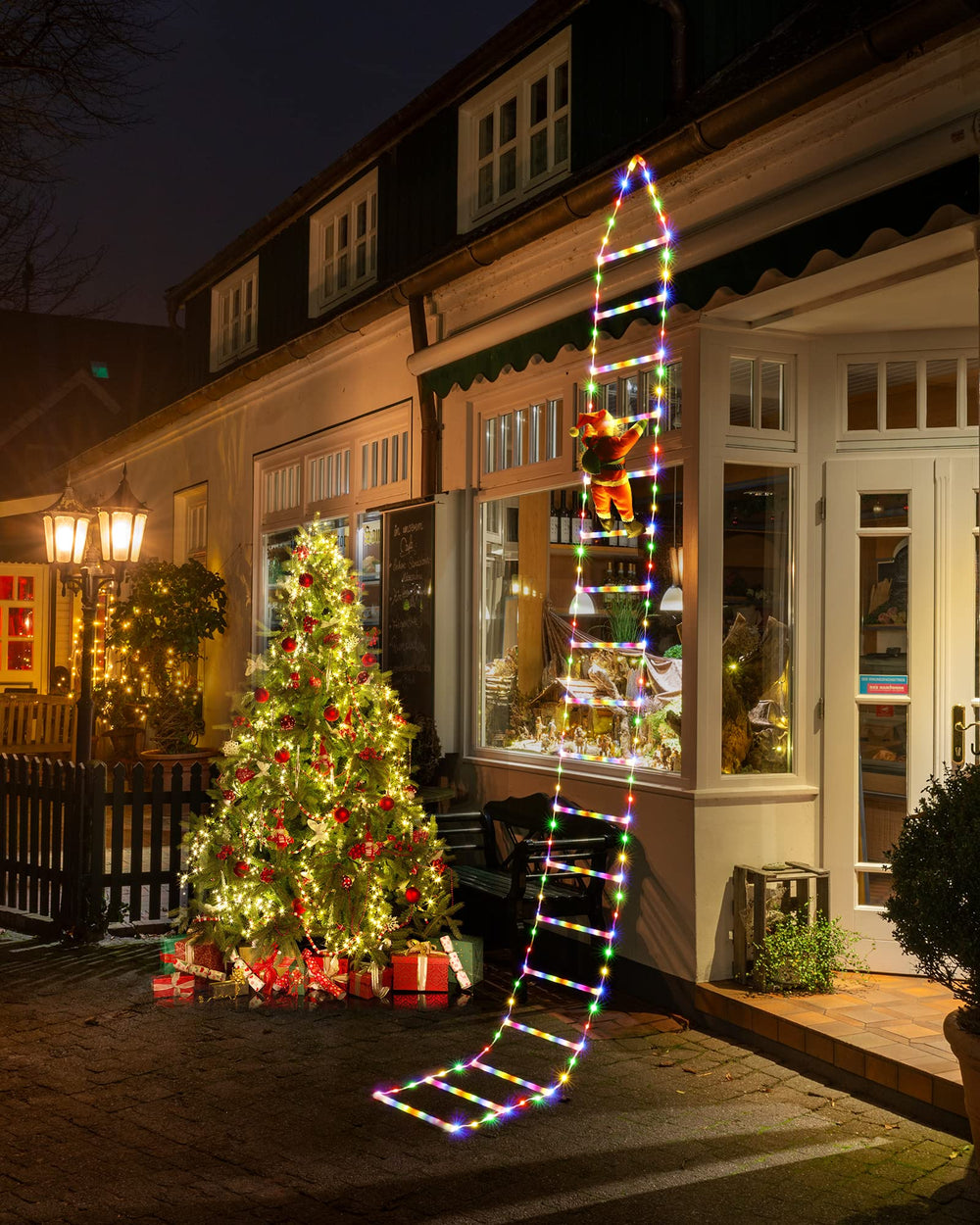 Joedoes ladder lights hung on porch eaves adding vertical holiday glow