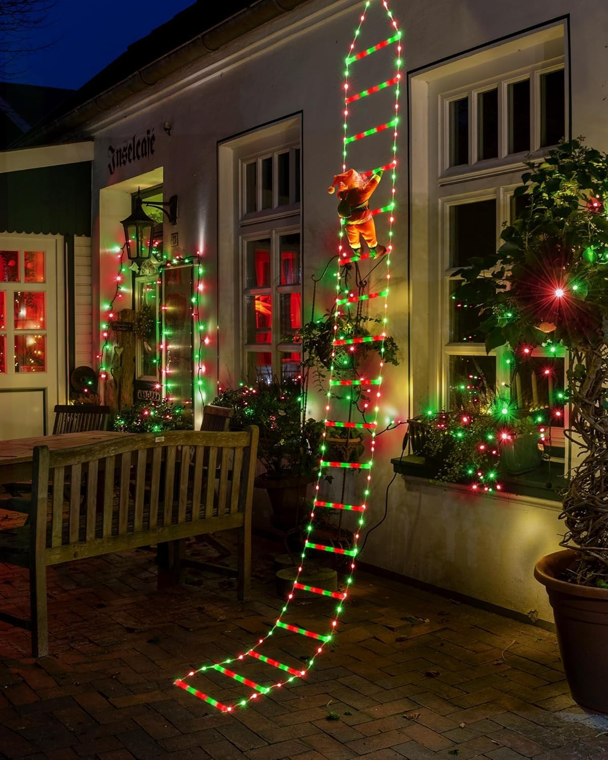 Joedoes ladder wound around Christmas tree creating layered light benefit