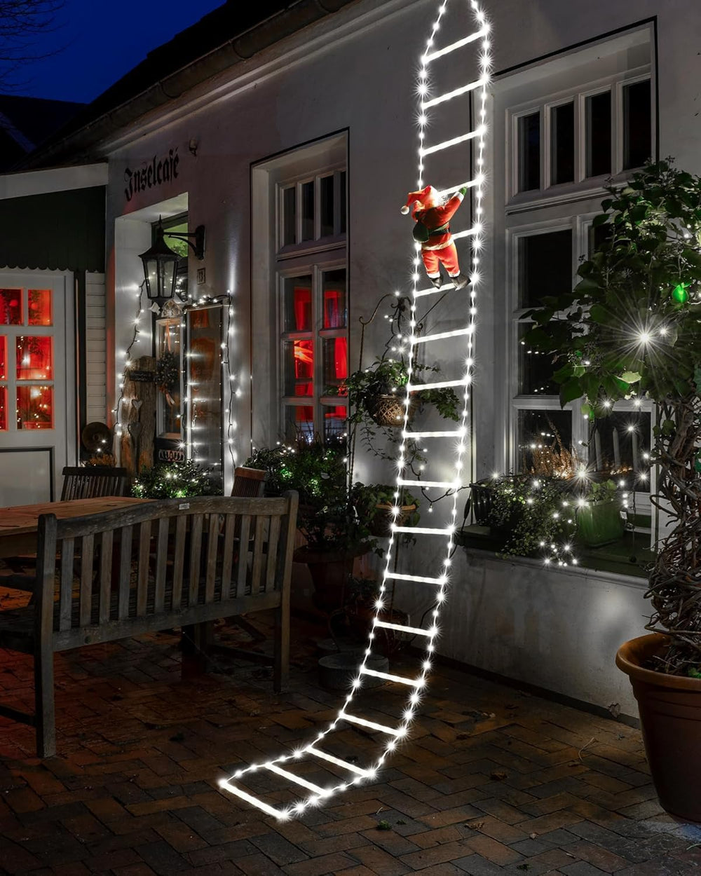 Joedoes ladder lights in window at night, adds festive curb appeal