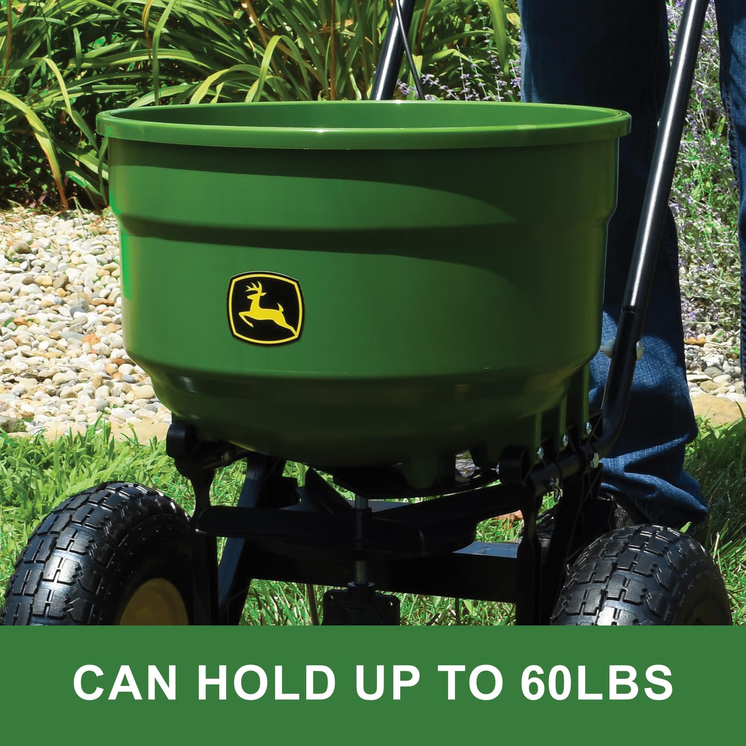 John Deere spreader in use dispersing seed across turf for even lawn coverage