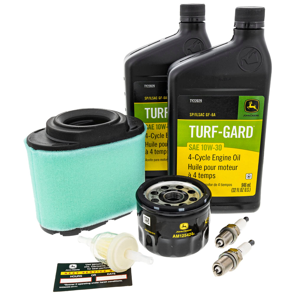 John Deere two quarts 10W-30 oil visible for proper engine lubrication