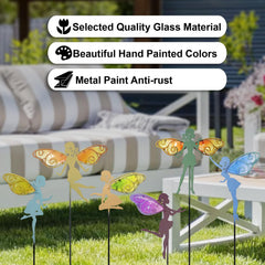 John's Studio stakes lined along garden pathway adding whimsical focal points