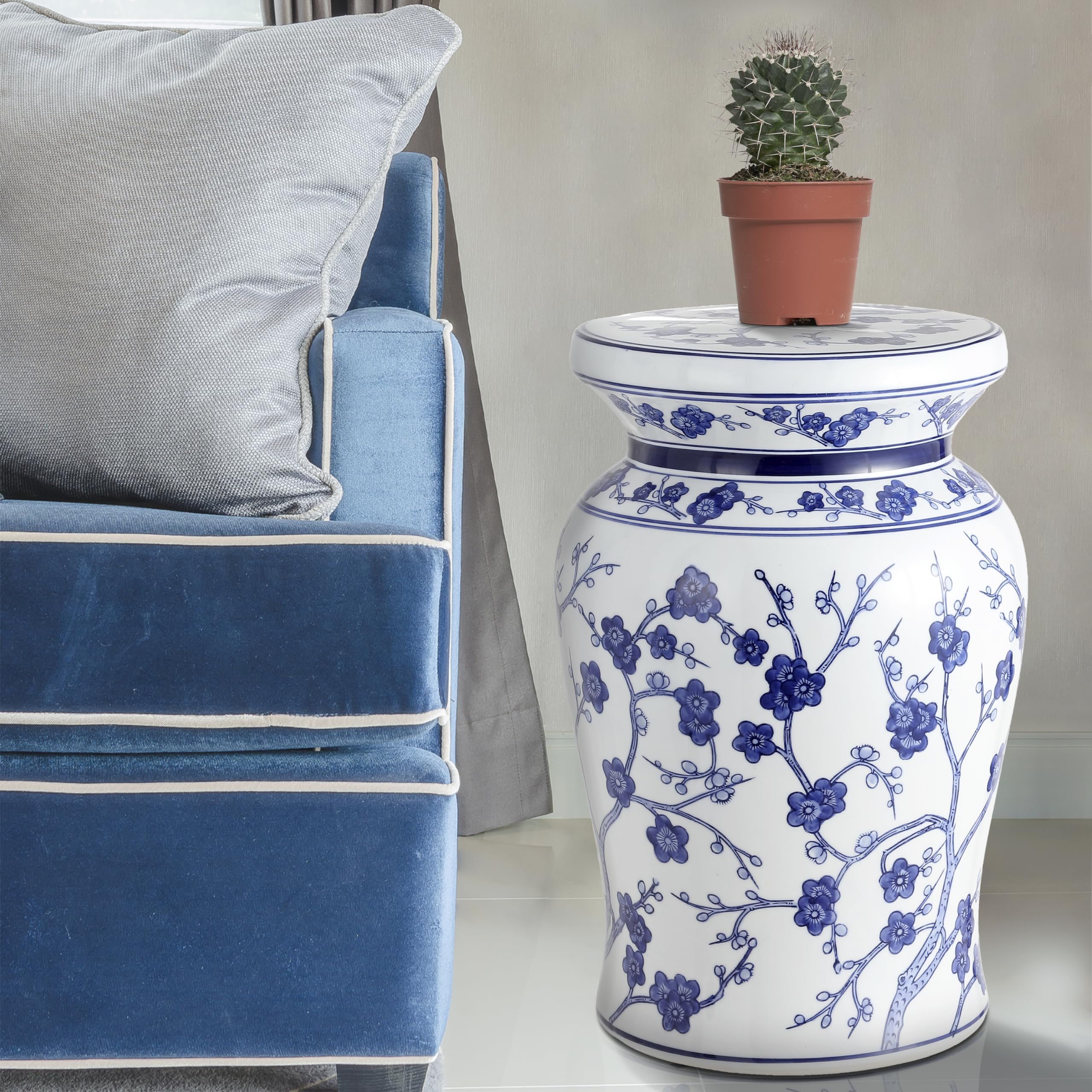 JONATHAN Y stool beside sofa used as side table for drinks and books