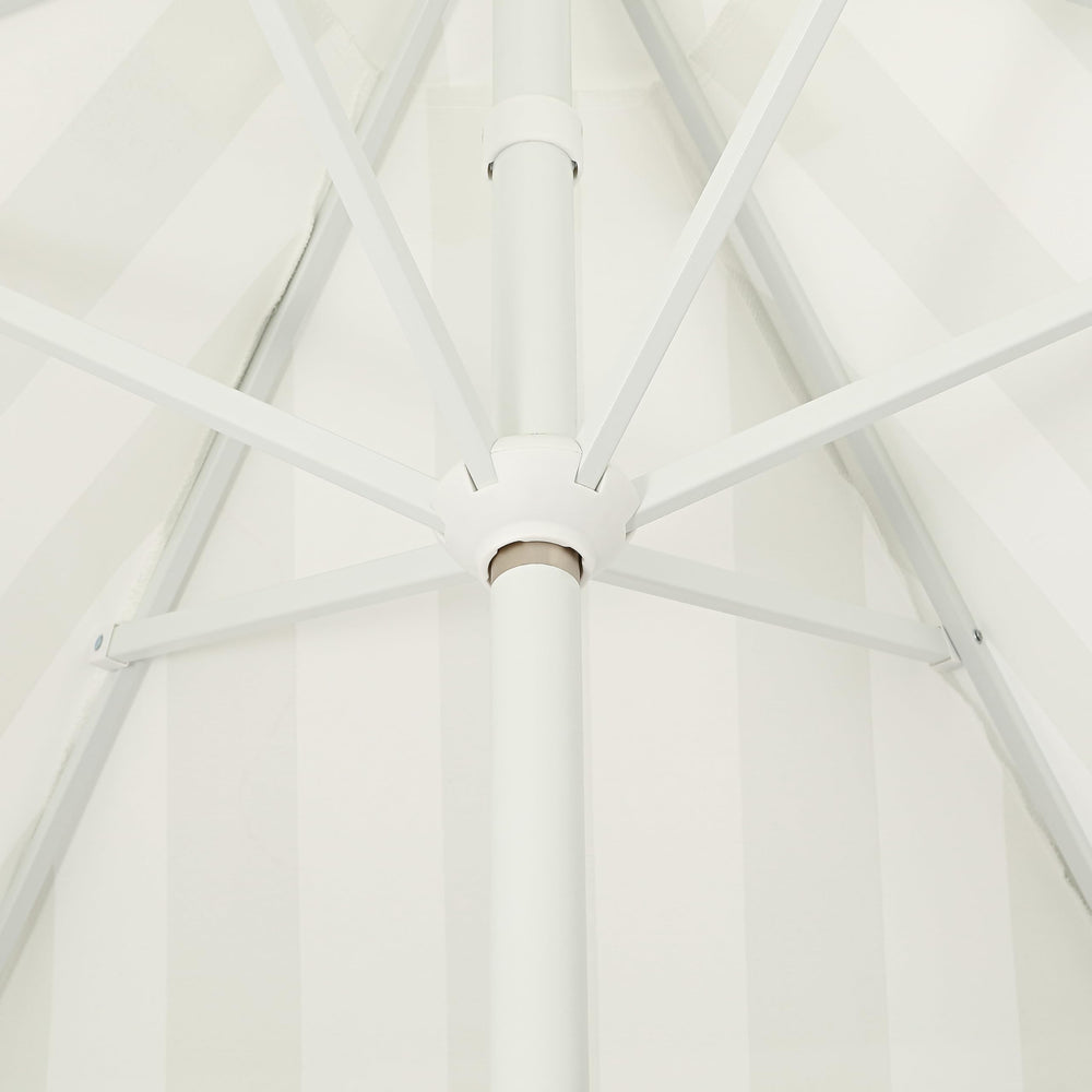 JONATHAN Y folded umbrella with packaging showing storage convenience