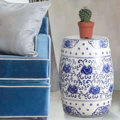 JONATHAN Y stool placed on patio surrounded by greenery offering garden elegance