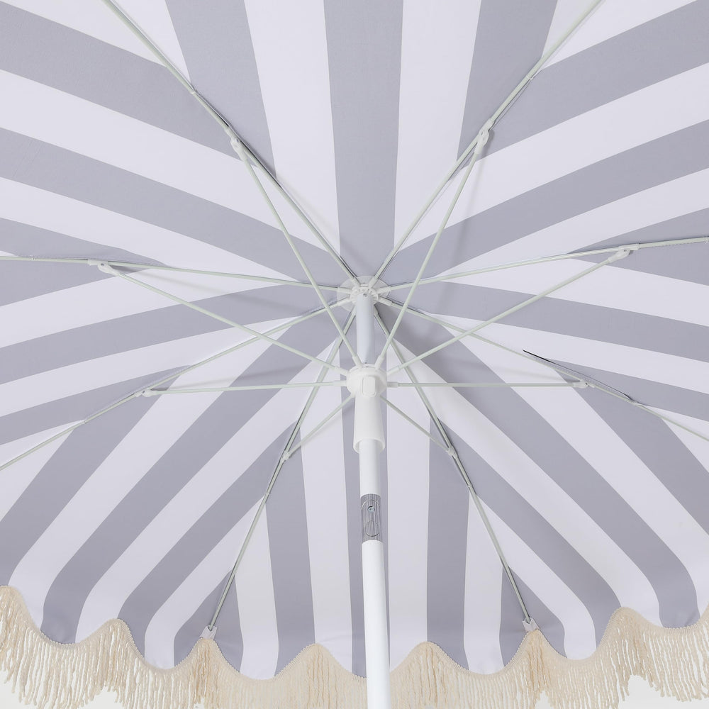 JONATHAN Y umbrella in a patio lifestyle scene showing how the design complements outdoor decor