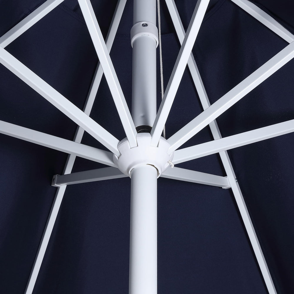 JONATHAN Y umbrella in a backyard scene conveying stylish summer protection