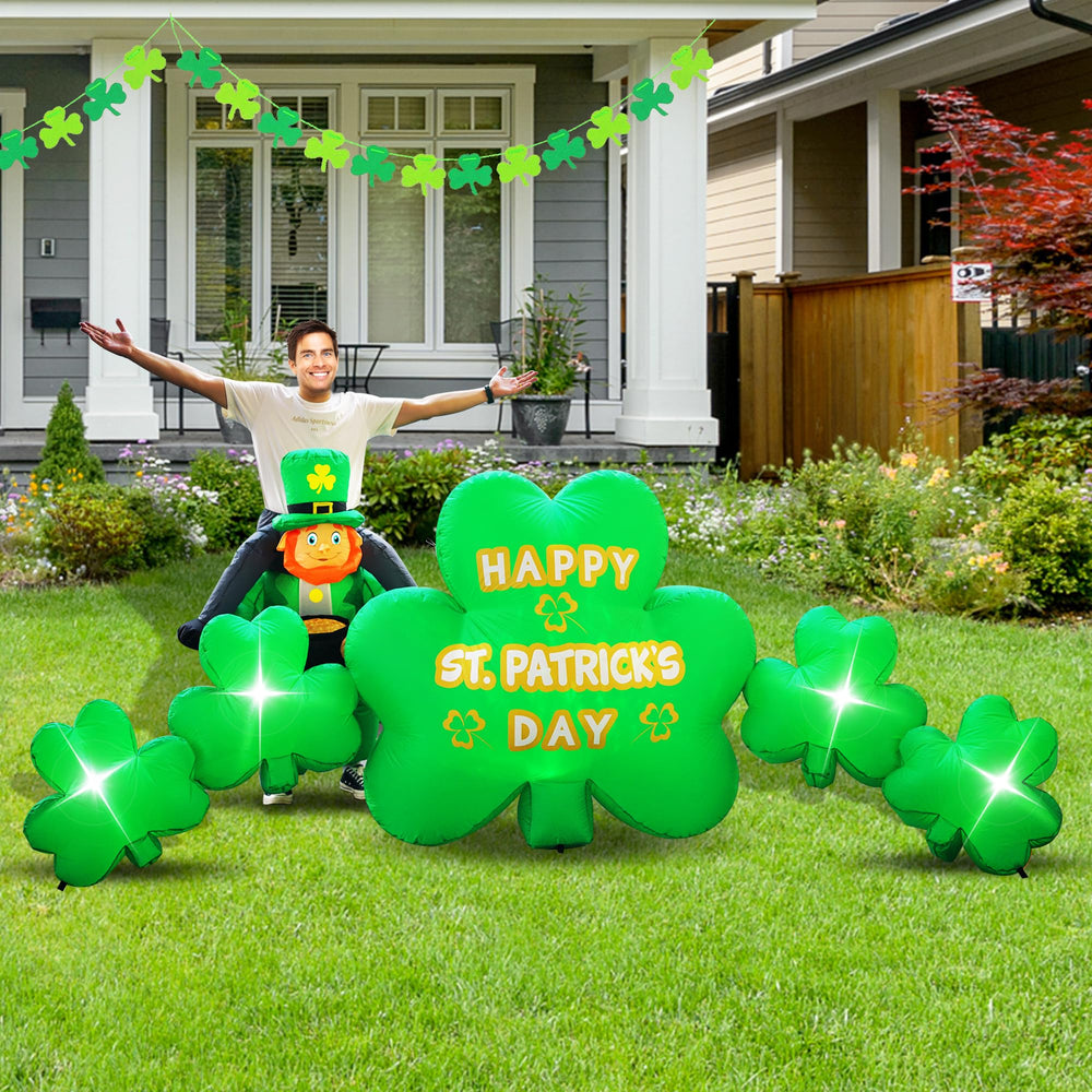 Joyfizzle lawn at night with illuminated shamrocks creating festive ambiance