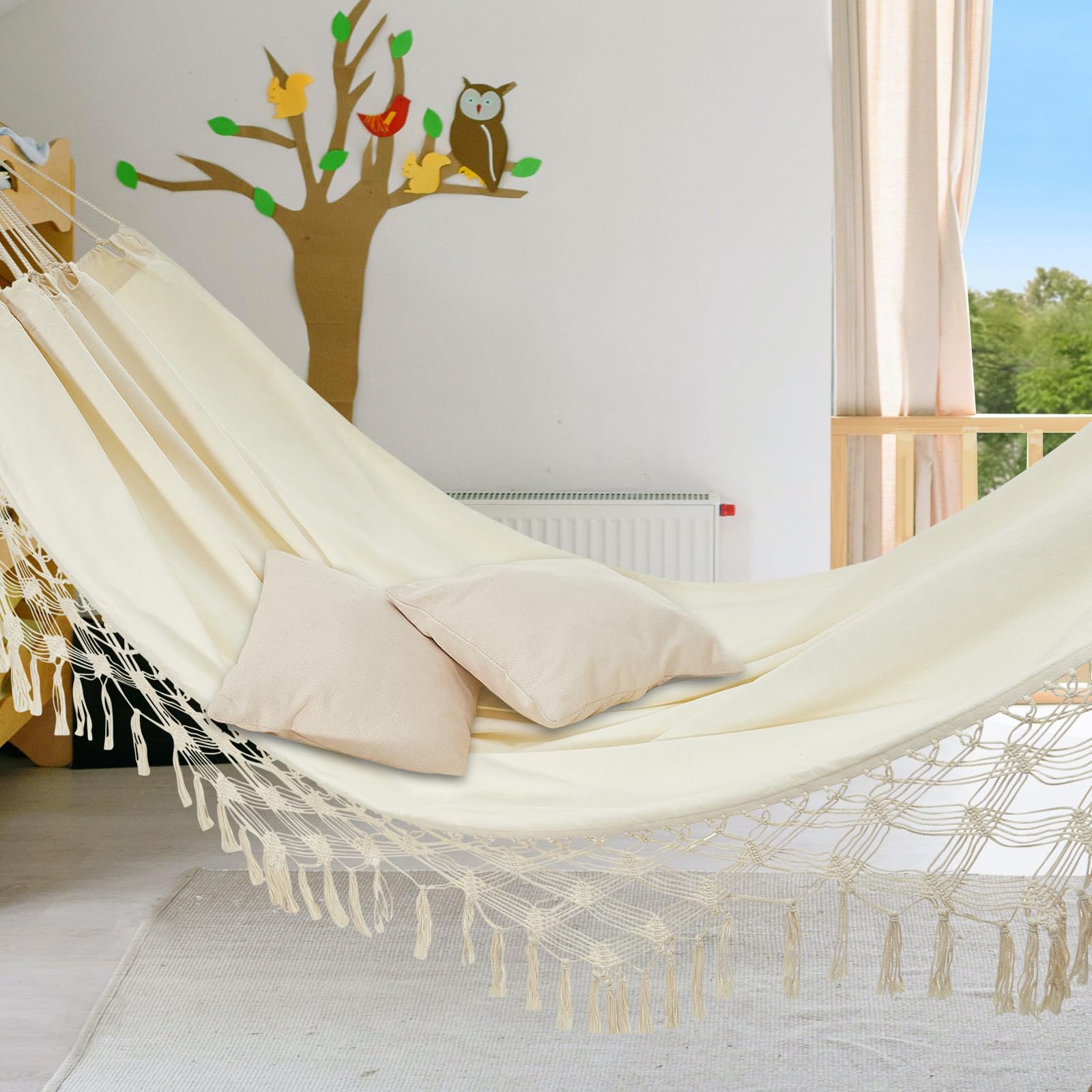 JoyView hammock beside chair showing scale and generous two-person space