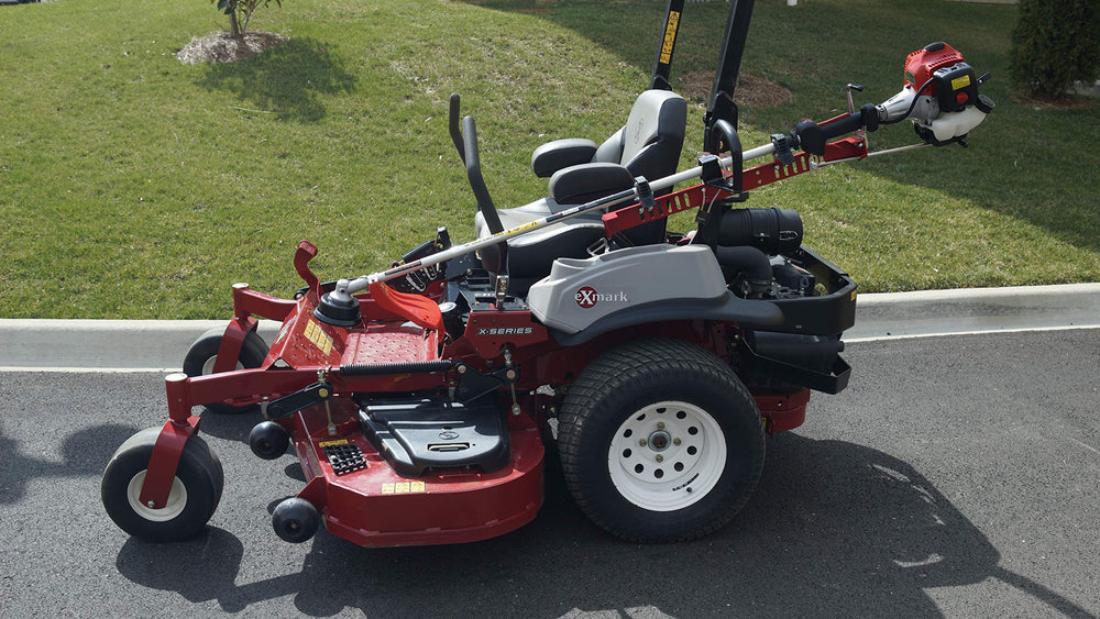 Jungle Jim's crew operating zero turn mower with ZTR-TR rack for jobsite efficiency
