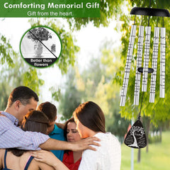 JUST FOR WIND wind chimes hanging in a garden offering peaceful outdoor remembrance