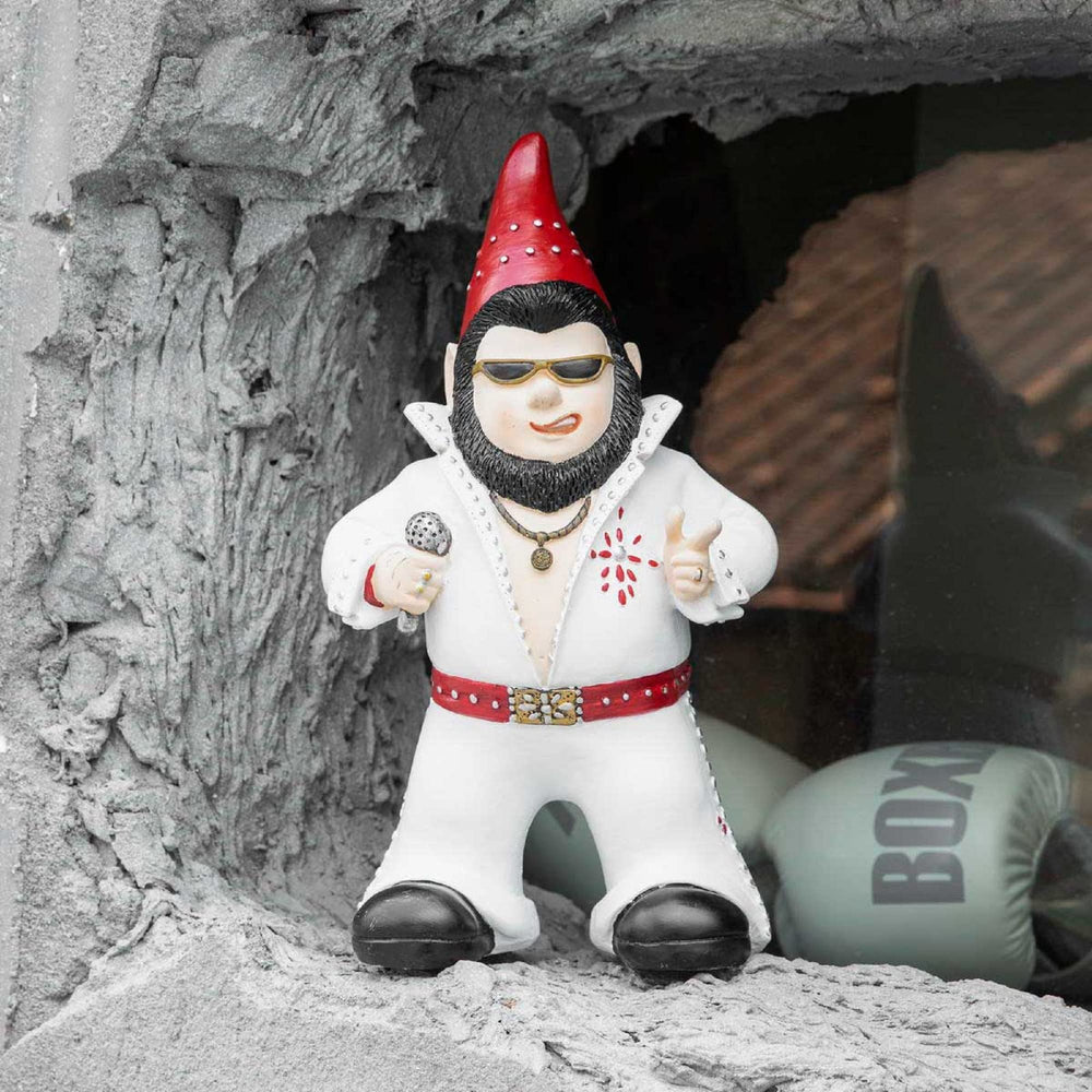 Jy.Cozy gnome staged in garden offering playful focal point for beds