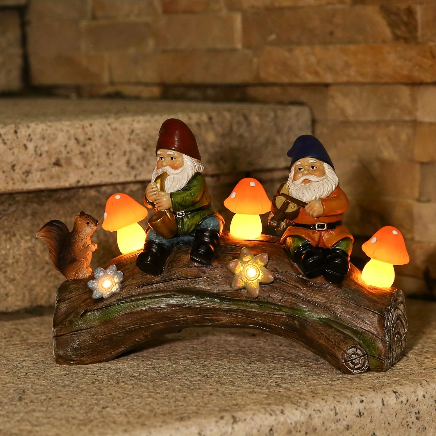 Jy.Cozy gnome lit at night demonstrating soft warm garden illumination