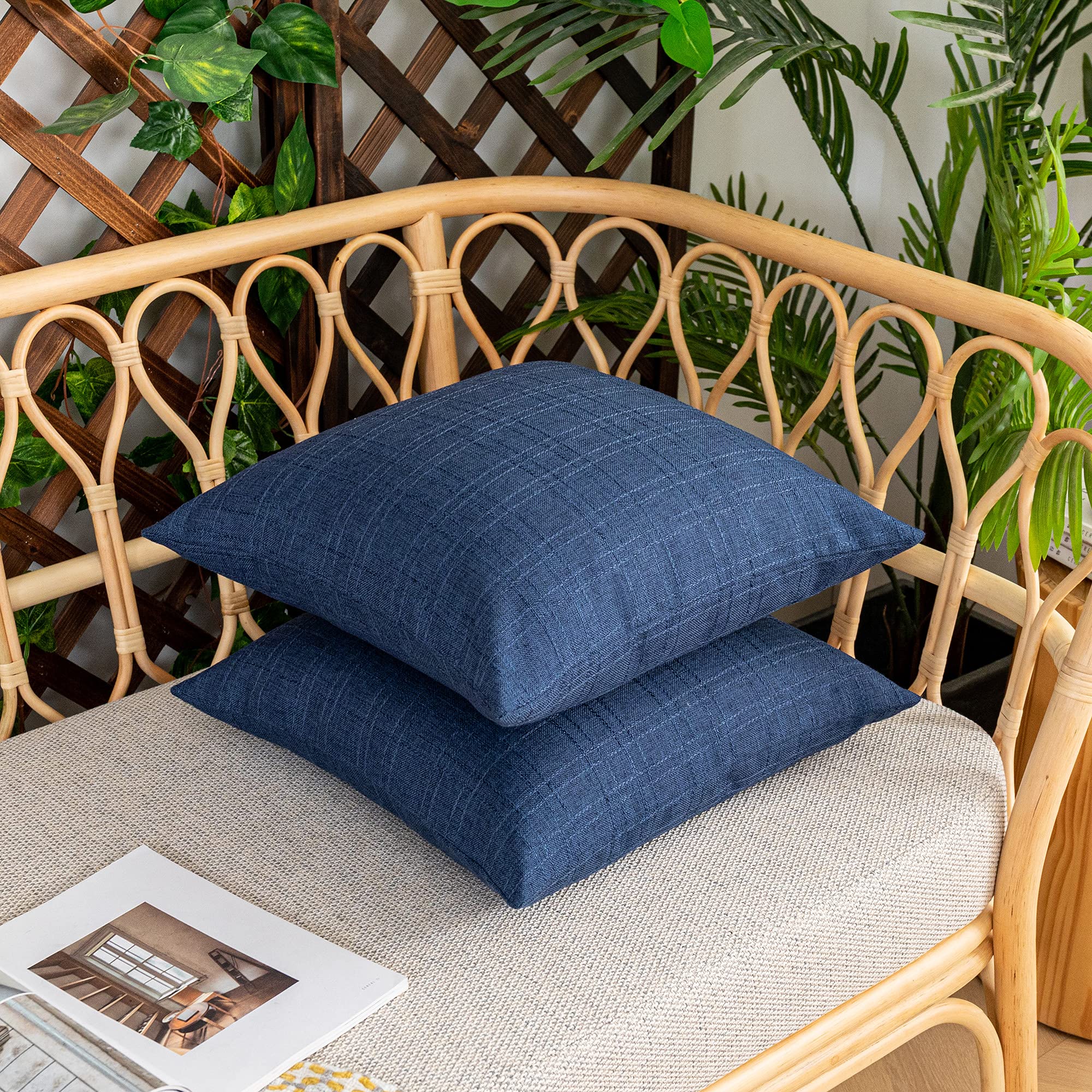 K KEVIN TEXTILE pillow covers staged on a patio chair highlighting outdoor styling benefit