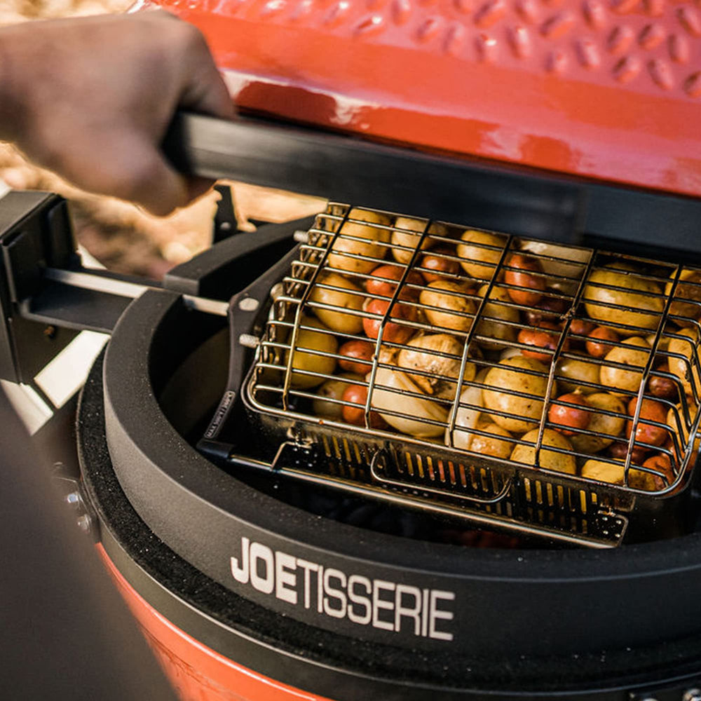 Kamado Joe flat basket holding a roasted chicken showing even roast benefit