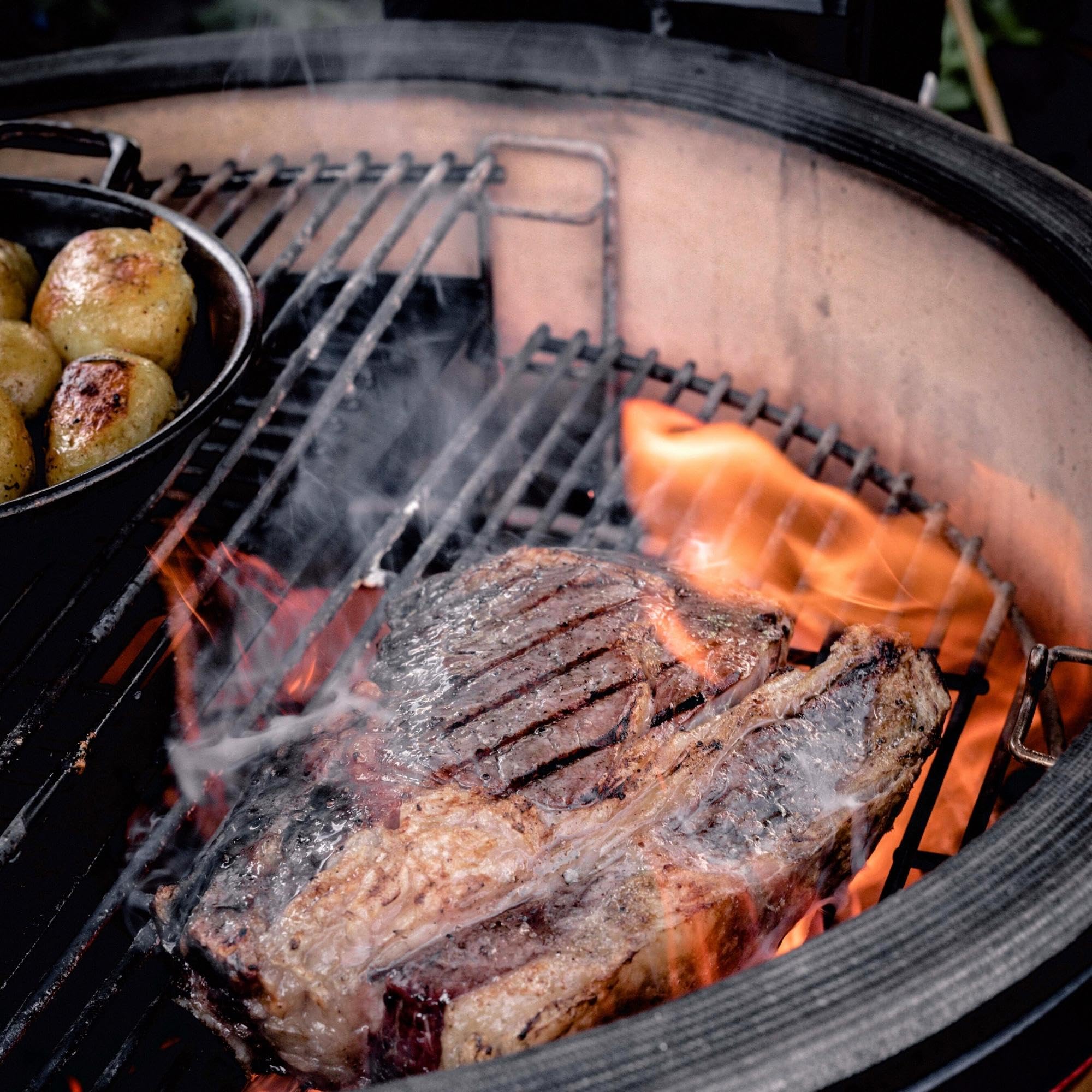 Kamado Joe expander in outdoor cookout scene showing more food and flexible cooking benefit
