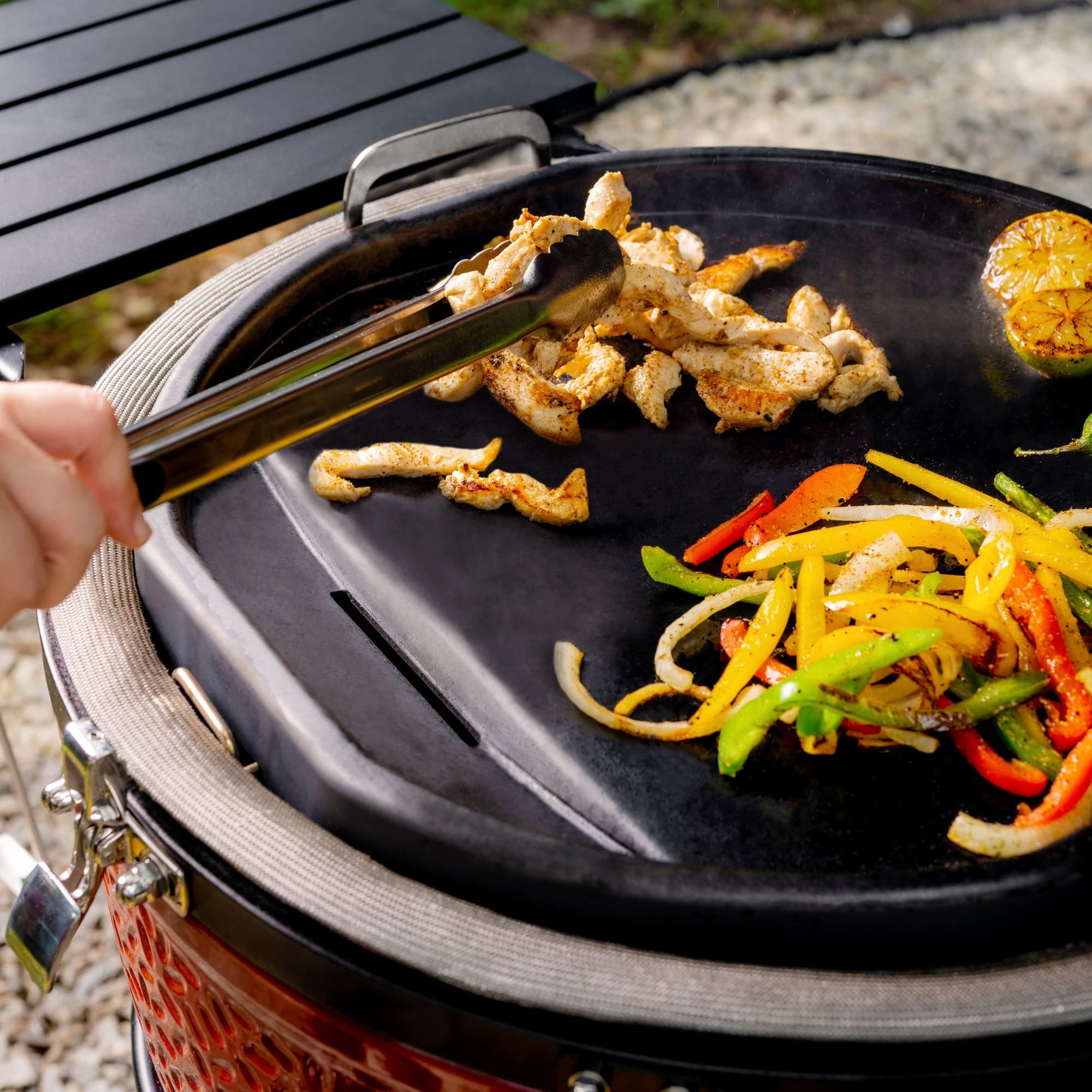 Kamado Joe detail shot of grease drain for easier cleanup