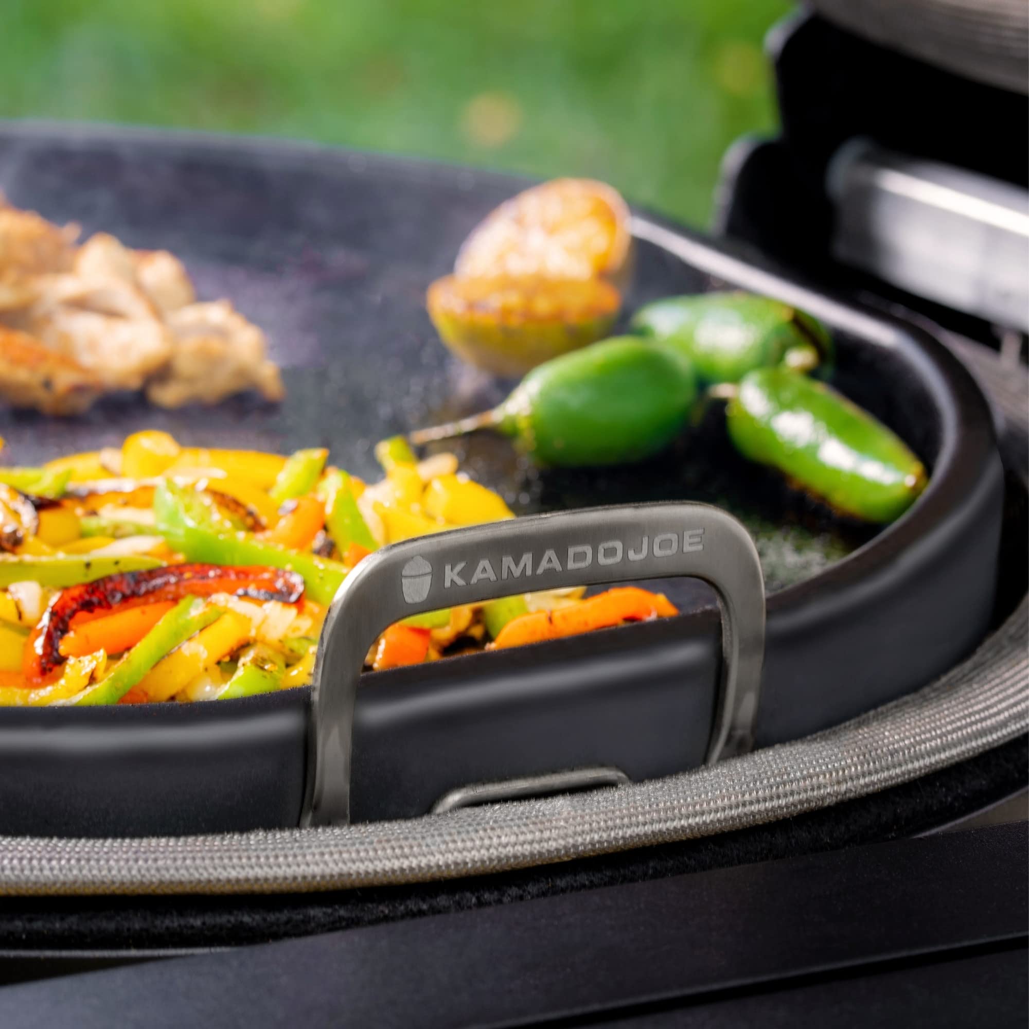 Kamado Joe griddle installed in Big Joe showing full coverage cooking
