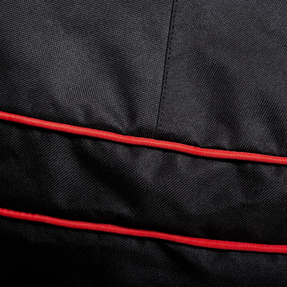 Kamado Joe side view highlighting adjustable buckle keeping cover secure
