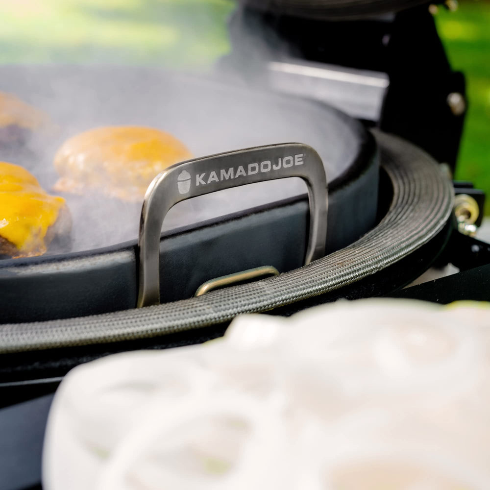 Kamado Joe griddle next to spatula showing size and scale