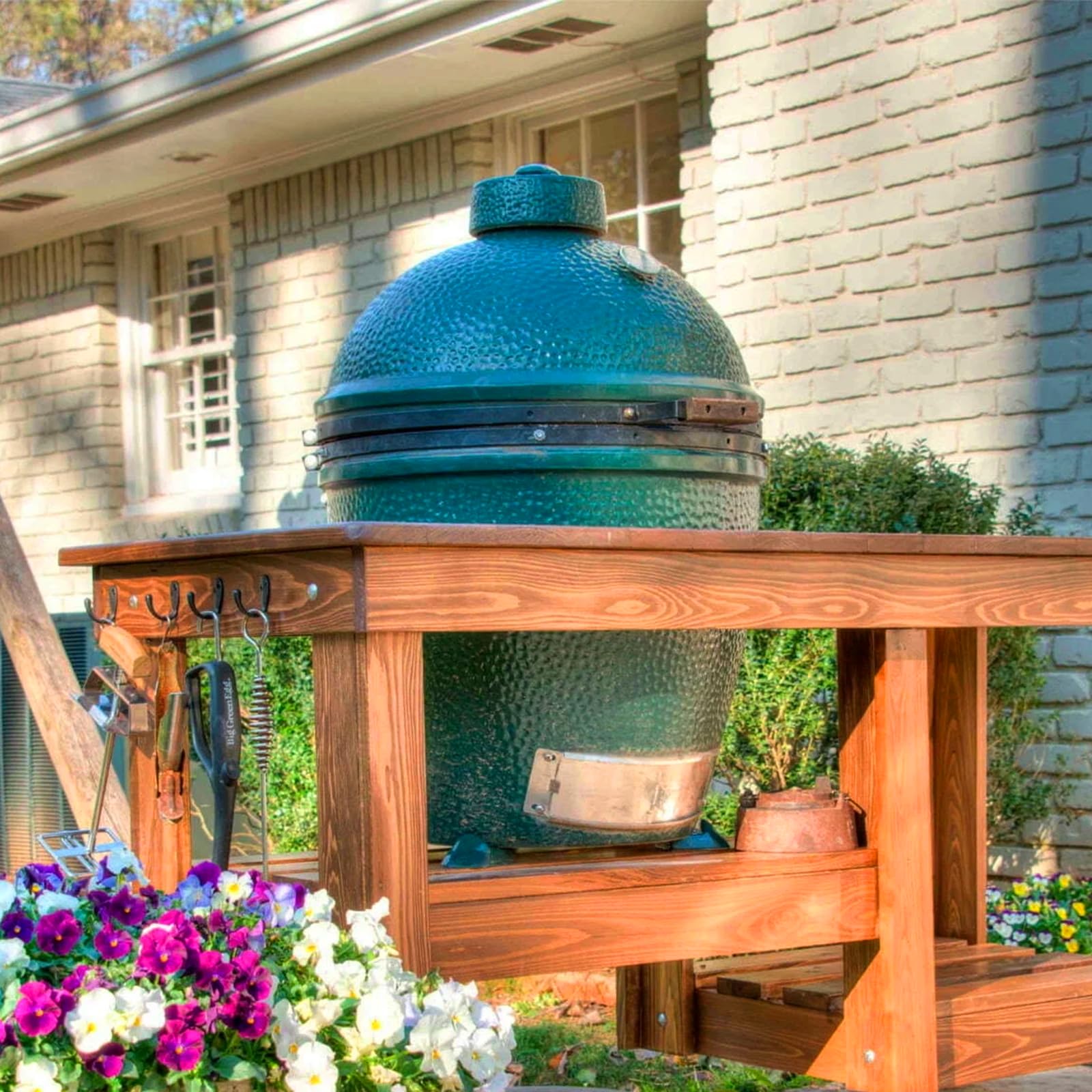 KAMaster grilled cookout on patio with feet protecting table surface