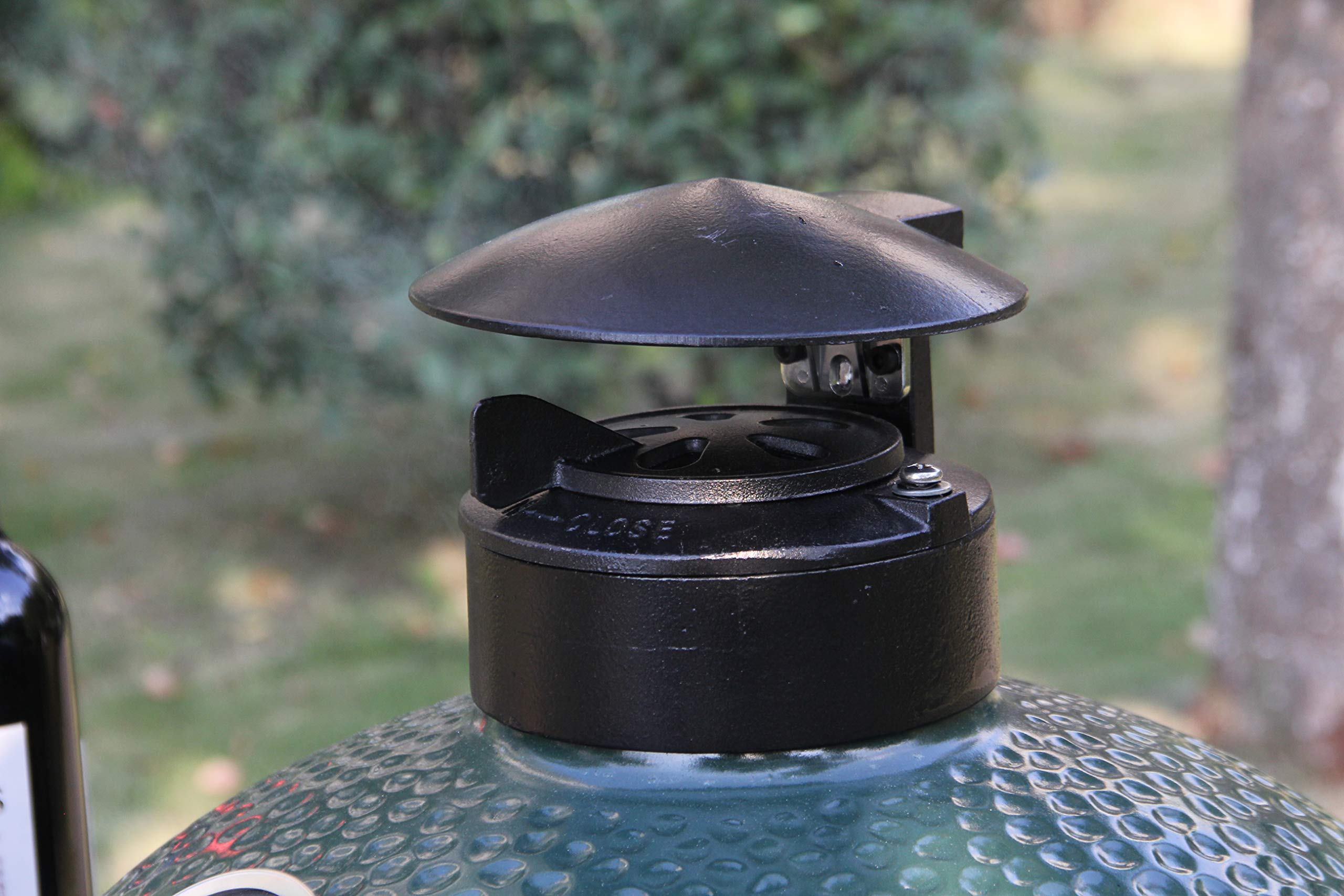 KAMaster in backyard grilling scene showing benefit of versatile all-weather accessory